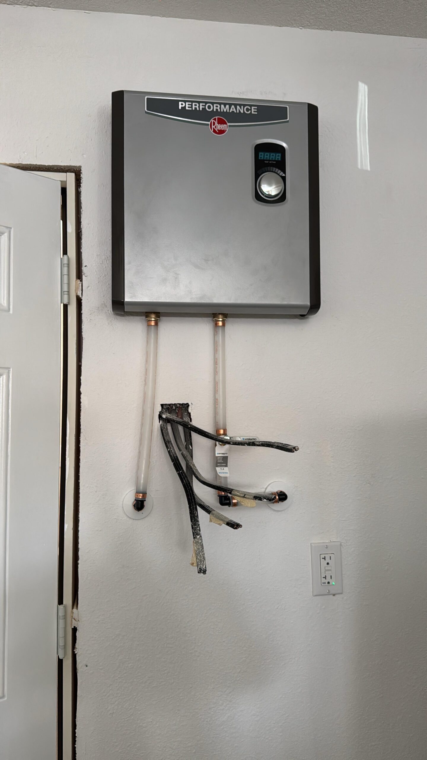 Blessed Solutions Plumbing technician performing water heater installation in Orlando FL
