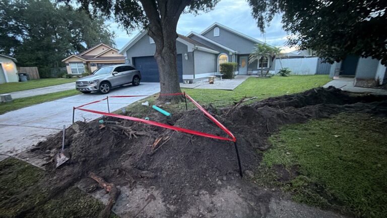 Residential main water line replacement - trench from the meter to the house by Blessed Solutions Plumbing, Orlando FL